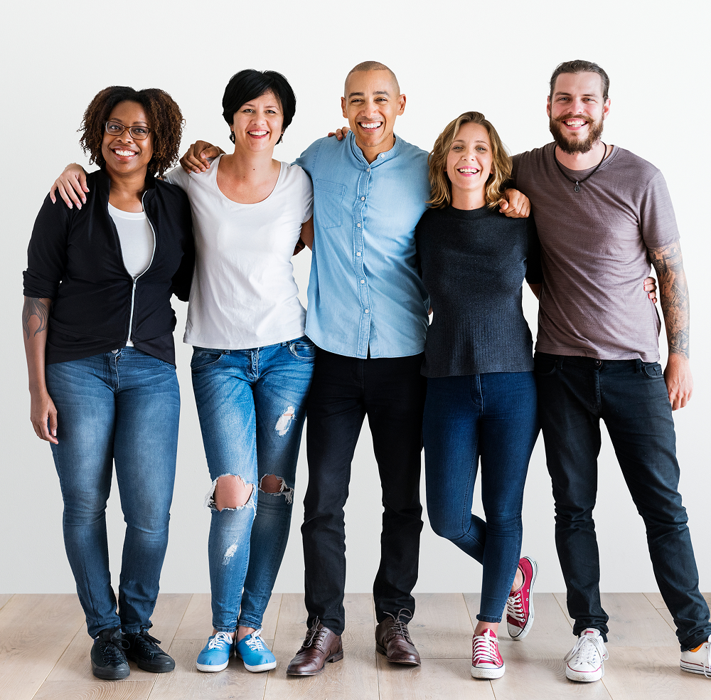 A diverse group of smiling adults standing together at Great Lakes Wellness Counseling for expert mental health support.